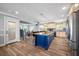 Island kitchen with granite countertops, stainless appliances, and breakfast bar seating at 601 2Nd St, Indian Rocks Beach, FL 33785