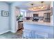 Updated kitchen features stainless appliances and white cabinets with a breakfast bar at 601 2Nd St, Indian Rocks Beach, FL 33785