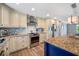 Modern kitchen with granite counters, stainless appliances, and custom cabinetry at 601 2Nd St, Indian Rocks Beach, FL 33785