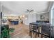 Open-concept living room featuring sleek floors, a dining area, and modern finishes at 601 2Nd St, Indian Rocks Beach, FL 33785