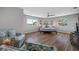 Spacious bedroom features wood floors, a ceiling fan, and large windows at 601 2Nd St, Indian Rocks Beach, FL 33785