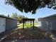 The backyard includes parking on both sides and an outdoor pergola in the middle at 6426 S Himes Ave, Tampa, FL 33611