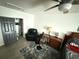 This bedroom features a ceiling fan, closet, and bedside table and lamp at 6426 S Himes Ave, Tampa, FL 33611