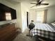 Bedroom featuring neutral colors, a ceiling fan, and plenty of natural light at 6426 S Himes Ave, Tampa, FL 33611