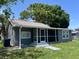 Charming home with a screened-in porch, perfect for enjoying the outdoors in comfort at 6426 S Himes Ave, Tampa, FL 33611