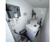 Functional laundry room with white washer and dryer and a tankless water heater at 6426 S Himes Ave, Tampa, FL 33611