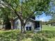Home featuring lush landscaping, providing privacy and a natural aesthetic at 6426 S Himes Ave, Tampa, FL 33611
