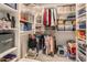 Organized walk-in closet features built-in shelving and ample storage for clothes and accessories at 70 Morning Dove Pl, Oldsmar, FL 34677