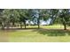 Scenic golf course view with mature trees and lush green fairways, perfect for a relaxing day on the links at 70 Morning Dove Pl, Oldsmar, FL 34677