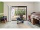 The office features a rolltop desk, a view of the lanai, and carpet flooring at 70 Morning Dove Pl, Oldsmar, FL 34677