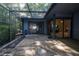 Covered patio space has an enclosed screen and features sliding glass door entries and exterior hose at 70 Morning Dove Pl, Oldsmar, FL 34677
