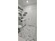 This bathroom features updated tile floors, updated fixtures and a neutral color palette at 7515 Brookhaven Ct, Tampa, FL 33634