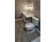 Bathroom featuring a updated toilet and vanity with good lighting at 7515 Brookhaven Ct, Tampa, FL 33634