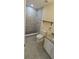 Bathroom featuring a walk-in shower with attractive tile accents and modern fixtures at 7515 Brookhaven Ct, Tampa, FL 33634
