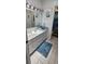 Bright bathroom featuring ample counter space and an ocean theme at 7515 Brookhaven Ct, Tampa, FL 33634
