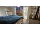 This bedroom offers a wood accent wall, mounted TV and an ensuite bathroom for convenience at 7515 Brookhaven Ct, Tampa, FL 33634