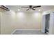 This bedroom features tile floors, a ceiling fan, an AC wall unit, and a closet at 7515 Brookhaven Ct, Tampa, FL 33634