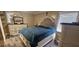 Comfortable bedroom with a large bed, dresser, and neutral color scheme for a relaxing atmosphere at 7515 Brookhaven Ct, Tampa, FL 33634