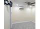 Comfortable bedroom featuring tile floors, neutral paint, and modern ceiling fan at 7515 Brookhaven Ct, Tampa, FL 33634