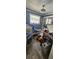 A childs bedroom with bright colors, a ceiling fan, toys and a sliding glass door for play at 7515 Brookhaven Ct, Tampa, FL 33634