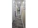 Long hallway with recessed lighting and doors leading to various rooms at 7515 Brookhaven Ct, Tampa, FL 33634