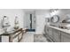 Bright, modern bathroom featuring double sinks, stylish vanity, and spacious shower at 7849 52Nd E Ter, Bradenton, FL 34203