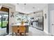 Bright kitchen features stainless appliances, an island with seating, and white cabinetry with coastal decor at 7849 52Nd E Ter, Bradenton, FL 34203