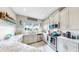 Bright kitchen features stainless appliances, plenty of counter space and white cabinetry, with coastal decor at 7849 52Nd E Ter, Bradenton, FL 34203