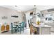 Bright kitchen with stainless steel appliances, white cabinetry, coastal decor, and an open concept feel at 7849 52Nd E Ter, Bradenton, FL 34203