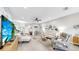 Spacious living room features modern decor, tile flooring, and a comfortable seating arrangement at 7849 52Nd E Ter, Bradenton, FL 34203