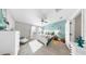 Airy main bedroom features coastal decor, light-colored walls, and a ceiling fan for comfort at 7849 52Nd E Ter, Bradenton, FL 34203