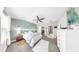 Airy main bedroom features coastal decor, light-colored walls, and a ceiling fan for comfort at 7849 52Nd E Ter, Bradenton, FL 34203