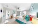 Well-lit main bedroom features coastal decor, light-colored walls, plush carpet and a ceiling fan at 7849 52Nd E Ter, Bradenton, FL 34203