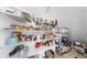 Organized walk-in pantry features wire shelving stocked with a variety of food items and supplies at 7849 52Nd E Ter, Bradenton, FL 34203