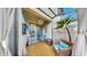 Cozy covered patio with outdoor furniture, a ceiling fan, and a mounted TV at 7849 52Nd E Ter, Bradenton, FL 34203