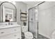 Bathroom featuring subway tile shower with glass door and modern vanity at 801 Kirkcaldy Way, Valrico, FL 33594