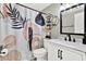 Stylish bathroom featuring a modern shower curtain and black hardware at 801 Kirkcaldy Way, Valrico, FL 33594