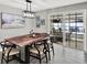 Dining room featuring a wooden table, modern lighting, and access to the patio at 801 Kirkcaldy Way, Valrico, FL 33594