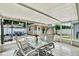 Outdoor patio with seating, a decorative rug, and a view of the landscaped backyard at 801 Kirkcaldy Way, Valrico, FL 33594