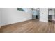 Spacious bedroom with hardwood floors, natural light, and a closet organizer system at 805 Paris S Ave, St Petersburg, FL 33701