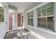 Relaxing balcony with large windows providing ample natural light and white railing at 834 N Oregon Ave, Tampa, FL 33606