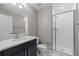 Bathroom featuring a sink, quartz countertop, shower and tile flooring at 834 N Oregon Ave, Tampa, FL 33606