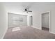 Spacious bedroom featuring lots of light, a ceiling fan, and neutral carpet at 834 N Oregon Ave, Tampa, FL 33606