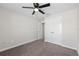 Bedroom with a ceiling fan, closet with double doors, and neutral walls and carpet at 834 N Oregon Ave, Tampa, FL 33606