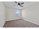 Bedroom with ceiling fan, window, neutral walls and carpet at 834 N Oregon Ave, Tampa, FL 33606