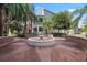 Beautiful courtyard with a central fountain and manicured landscaping, perfect for relaxation at 834 N Oregon Ave, Tampa, FL 33606