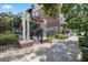 Inviting entrance to West End Tampa with decorative gate and manicured greenery at 834 N Oregon Ave, Tampa, FL 33606
