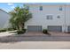 Townhome with attached garages, beautiful landscaping, and a well-maintained exterior at 834 N Oregon Ave, Tampa, FL 33606