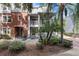 Charming two-story townhome with brick accents and a welcoming front porch at 834 N Oregon Ave, Tampa, FL 33606