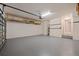 Clean, empty garage with sealed floor and space for two cars, offers additional storage at 834 N Oregon Ave, Tampa, FL 33606
